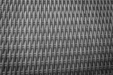 Sentetik rattan dokuma arka planı bahçe mobilyalarında kullanılıyor..