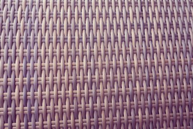 Sentetik rattan dokuma arka planı bahçe mobilyalarında kullanılıyor..