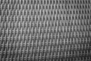 Sentetik rattan dokuma arka planı bahçe mobilyalarında kullanılıyor..