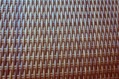 Sentetik rattan dokuma arka planı bahçe mobilyalarında kullanılıyor..