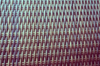 Sentetik rattan dokuma arka planı bahçe mobilyalarında kullanılıyor..