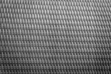 Sentetik rattan dokuma arka planı bahçe mobilyalarında kullanılıyor..