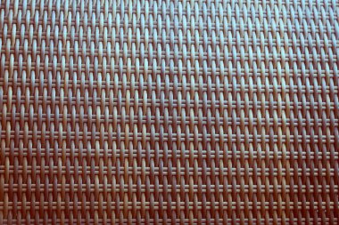 Sentetik rattan dokuma arka planı bahçe mobilyalarında kullanılıyor..