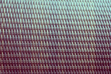 Sentetik rattan dokuma arka planı bahçe mobilyalarında kullanılıyor..