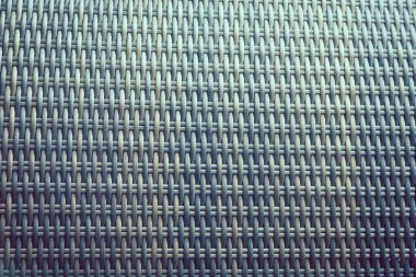 Sentetik rattan dokuma arka planı bahçe mobilyalarında kullanılıyor..