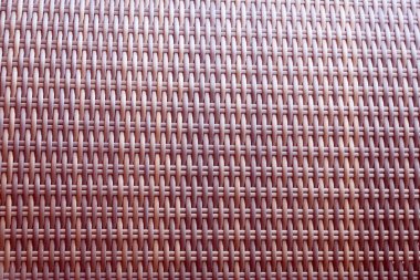 Sentetik rattan dokuma arka planı bahçe mobilyalarında kullanılıyor..