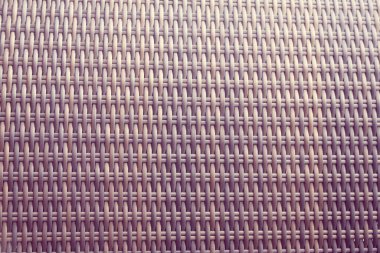 Sentetik rattan dokuma arka planı bahçe mobilyalarında kullanılıyor..