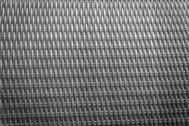 Sentetik rattan dokuma arka planı bahçe mobilyalarında kullanılıyor..