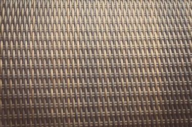 Sentetik rattan dokuma arka planı bahçe mobilyalarında kullanılıyor..