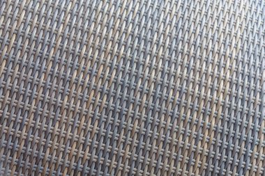 Sentetik rattan dokuma arka planı bahçe mobilyalarında kullanılıyor..