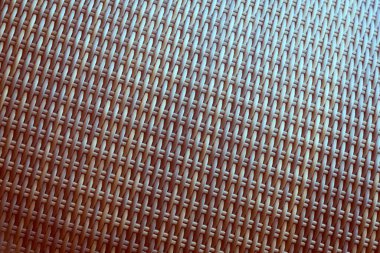 Sentetik rattan dokuma arka planı bahçe mobilyalarında kullanılıyor..