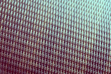 Sentetik rattan dokuma arka planı bahçe mobilyalarında kullanılıyor..