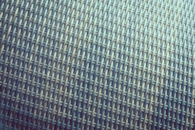 Sentetik rattan dokuma arka planı bahçe mobilyalarında kullanılıyor..