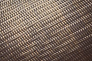 Sentetik rattan dokuma arka planı bahçe mobilyalarında kullanılıyor..