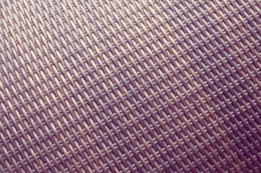 Sentetik rattan dokuma arka planı bahçe mobilyalarında kullanılıyor..