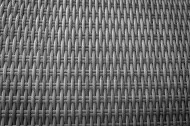 Sentetik rattan dokuma arka planı bahçe mobilyalarında kullanılıyor..