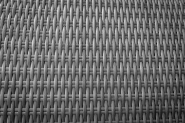 Sentetik rattan dokuma arka planı bahçe mobilyalarında kullanılıyor..