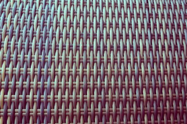 Sentetik rattan dokuma arka planı bahçe mobilyalarında kullanılıyor..