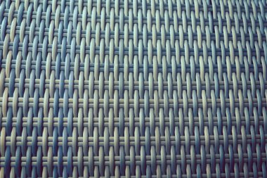 Sentetik rattan dokuma arka planı bahçe mobilyalarında kullanılıyor..