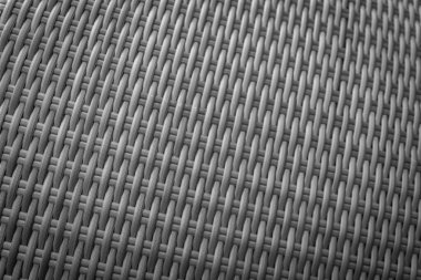 Sentetik rattan dokuma arka planı bahçe mobilyalarında kullanılıyor..