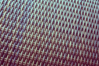 Sentetik rattan dokuma arka planı bahçe mobilyalarında kullanılıyor..