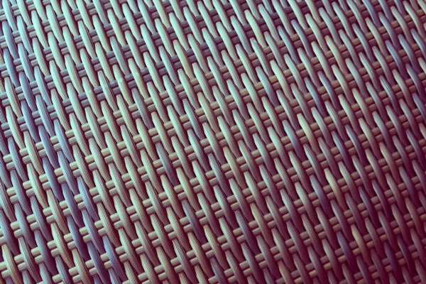 Sentetik rattan dokuma arka planı bahçe mobilyalarında kullanılıyor..