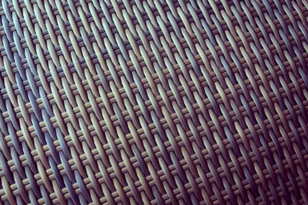 Sentetik rattan dokuma arka planı bahçe mobilyalarında kullanılıyor..