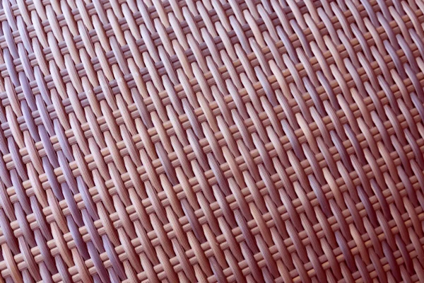 Sentetik rattan dokuma arka planı bahçe mobilyalarında kullanılıyor..
