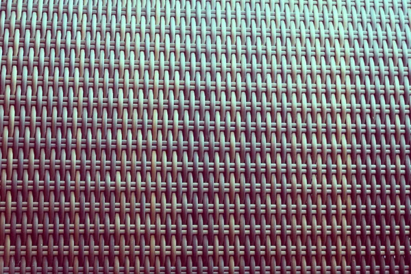 Sentetik rattan dokuma arka planı bahçe mobilyalarında kullanılıyor..