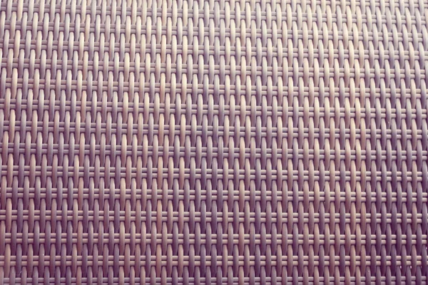 Sentetik rattan dokuma arka planı bahçe mobilyalarında kullanılıyor..