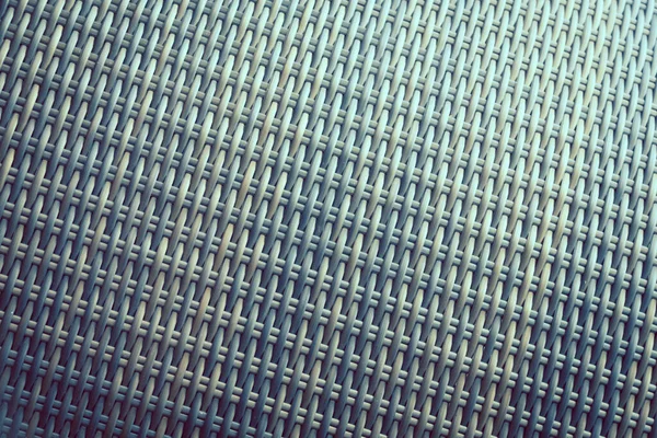 Sentetik rattan dokuma arka planı bahçe mobilyalarında kullanılıyor..