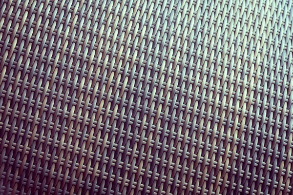 Sentetik rattan dokuma arka planı bahçe mobilyalarında kullanılıyor..