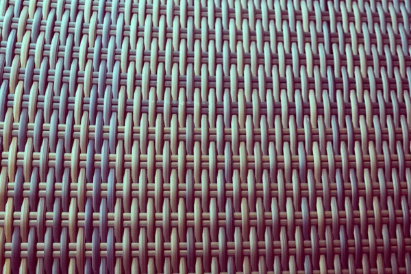 Sentetik rattan dokuma arka planı bahçe mobilyalarında kullanılıyor..