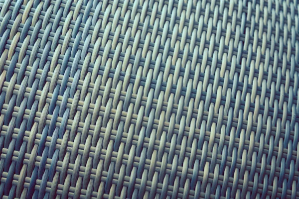 Sentetik rattan dokuma arka planı bahçe mobilyalarında kullanılıyor..