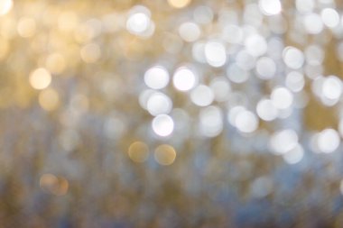 Altın ve gümüş renkli ışıltı soyut arkaplan