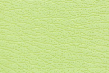 Kanepenin yüzeyinde yapay deri bir arka plan var.