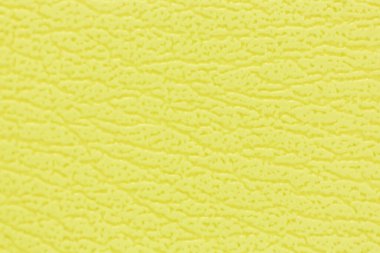 Kanepenin yüzeyinde yapay deri bir arka plan var.