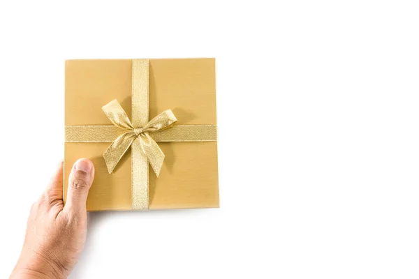 Χέρι Δώσει Χρυσό Κουτί Δώρου Χρυσό Τόξο Απομονώνονται Λευκό Φόντο — Φωτογραφία Αρχείου