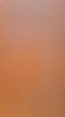 Arkaplan ve tasarım çalışmaları için kahverengi deri dokusunun yakınlaştırılması.