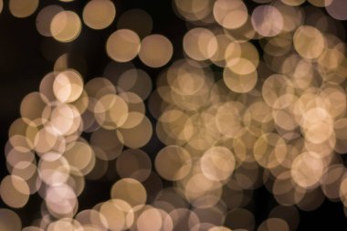 Altın rengi bokeh zarif soyut arkaplan ve bokeh odaklı ışıklar