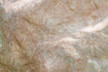 Açık sarı ve gri mermer, doğal desenli ve desenli.