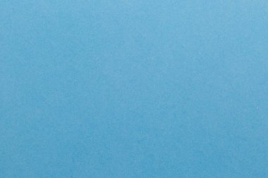 Mavi kağıt desenli boş bir yaprak. Siyah zemin.