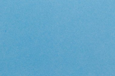 Mavi kağıt desenli boş bir yaprak. Siyah zemin.