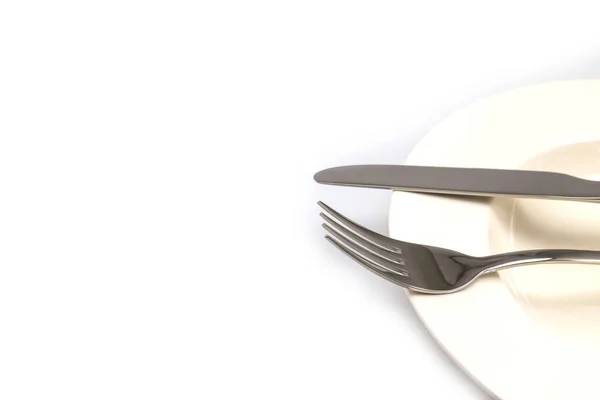 Tenedor Cuchillo Acero Inoxidable Sobre Una Placa Blanca Aislada Sobre —  Fotos de Stock