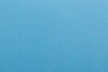 Mavi kağıt desenli boş bir yaprak. Siyah zemin.