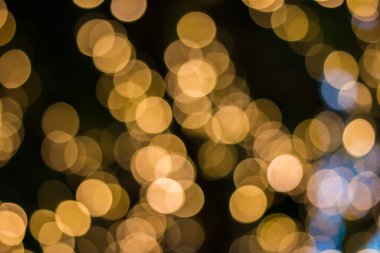 Altın rengi bokeh zarif soyut arkaplan ve bokeh odaklı ışıklar
