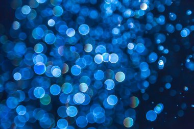 Mavi parıltılı bokeh ışıkları bokeh odaklanmamış arkaplan