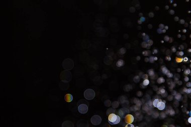 Siyah arkaplanda ışık bokeh