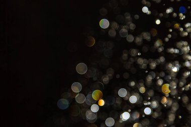 Siyah arkaplanda ışık bokeh