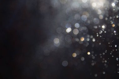 Su sineği bokeh ve siyah zemin üzerinde ışıklar